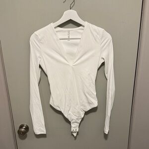 AKIRA Elegant White V-Neck Bodysuit